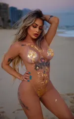 Nina naked with gold flakes covering her private parts 